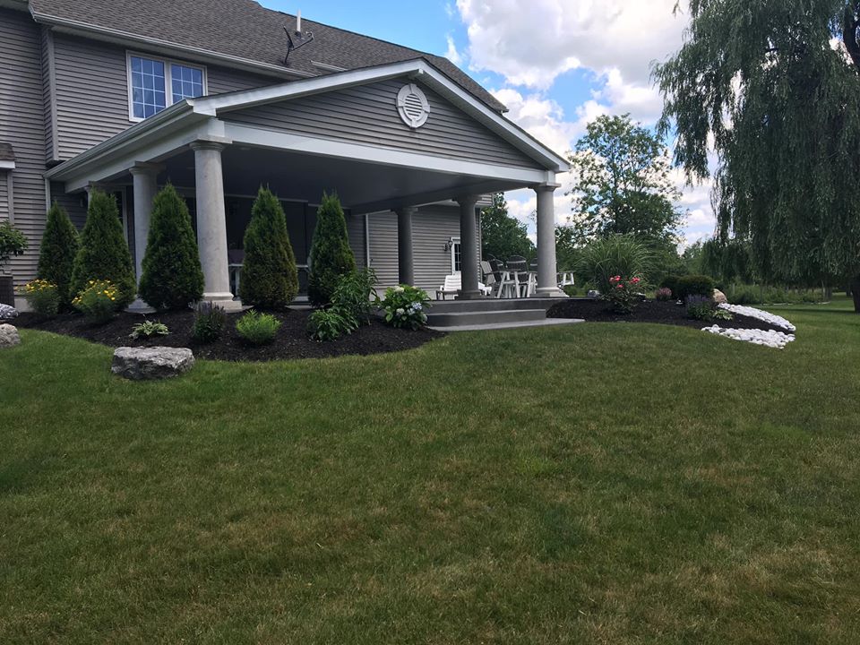 backyard with landscape around porch