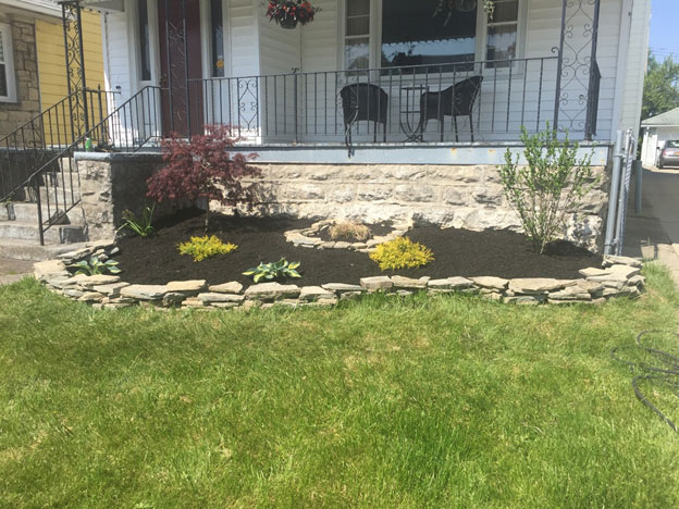 landscape in front of porch