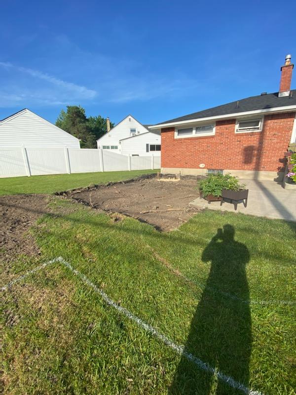 Backyard prepared for paver patio installation