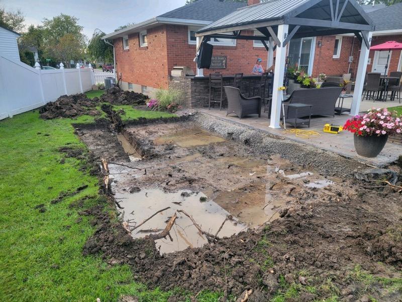 Yard dug up for paver patio