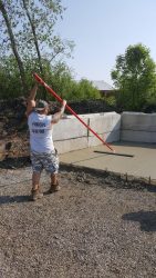 man smoothing concrete
