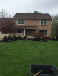wheelbarrow in front of house